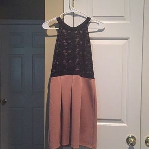 A Black and Creme colored lace short dress